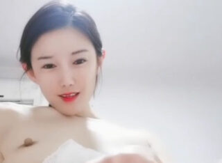 Beautiful young woman takes selfies and touches her acupoints